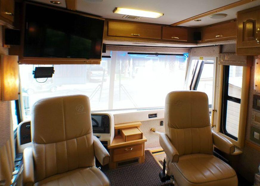 84136 Ave 44, Unit 587 Indio, CA 92203 - Photo 36 of 36 a living room with a couch and a flat screen tv