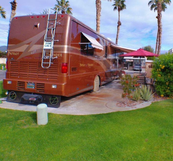 84136 Ave 44, Unit 587 Indio, CA 92203 - Photo 9 of 36 a front view of a house with garden