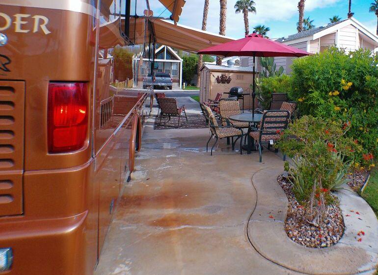 84136 Ave 44, Unit 587 Indio, CA 92203 - Photo 10 of 36 a dining room with furniture and a potted plant