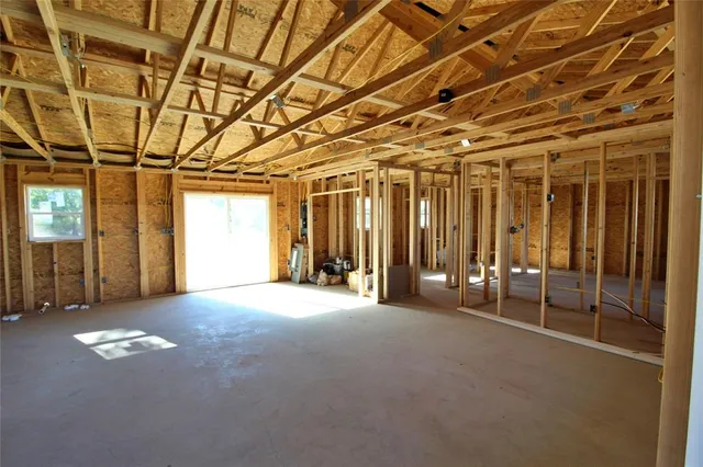 a view of empty room with windows