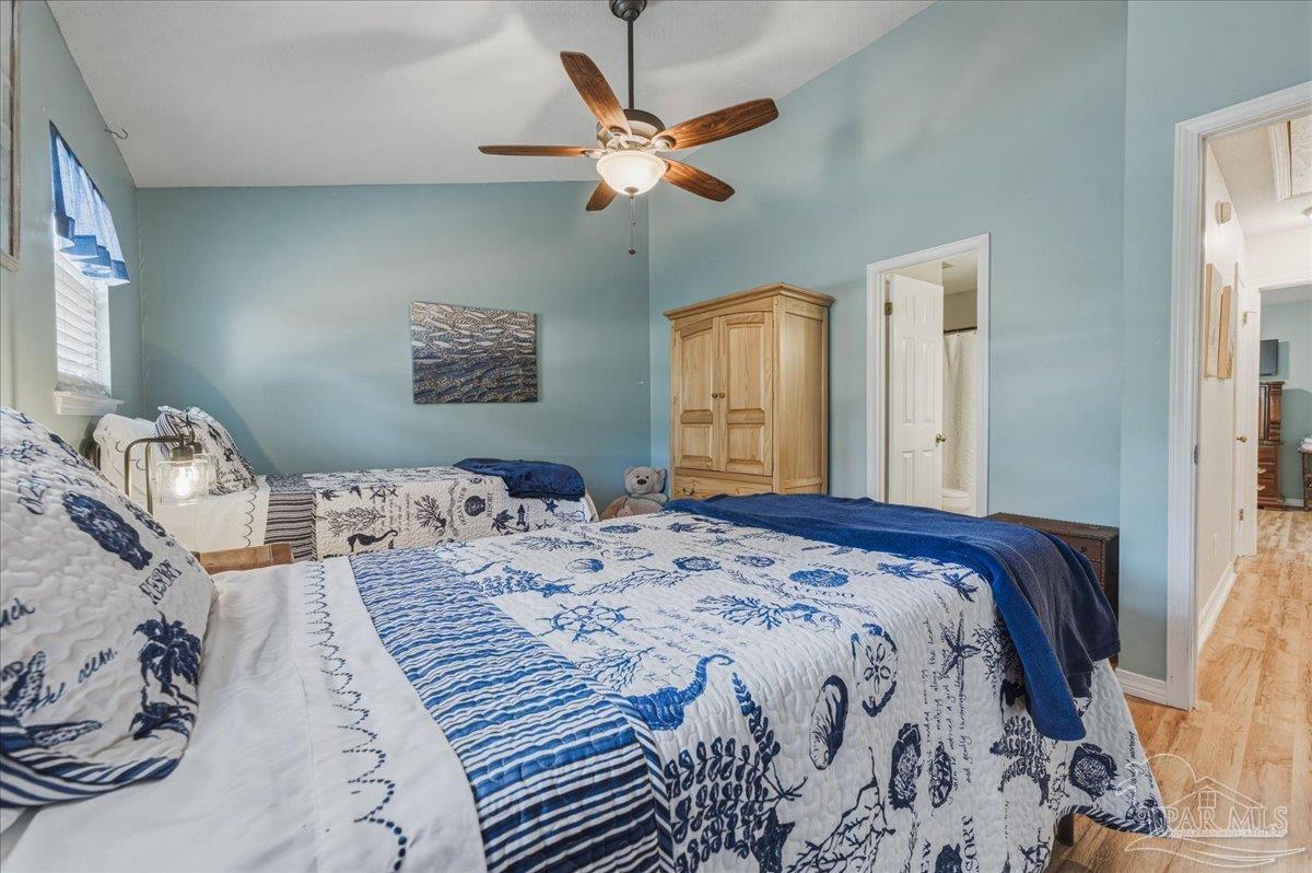 26063 Canal Road, Unit 3F Orange Beach, AL 36561 - Photo 56 of 72 a bedroom with a bed and window