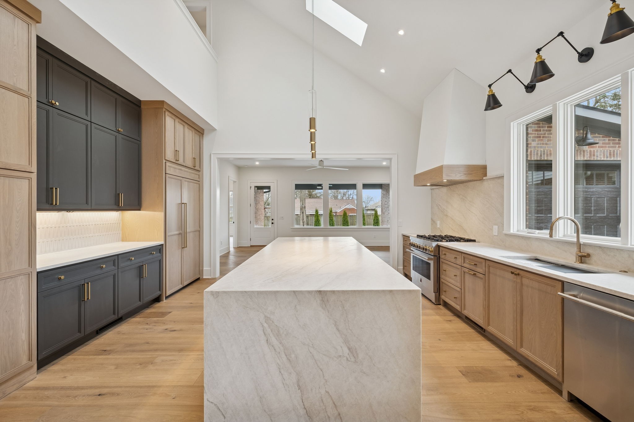 1130 Winding Way Road Nashville, TN 37216 - Photo 19 of 96 a large kitchen with kitchen island a large counter top space a sink stainless steel appliances and cabinets
