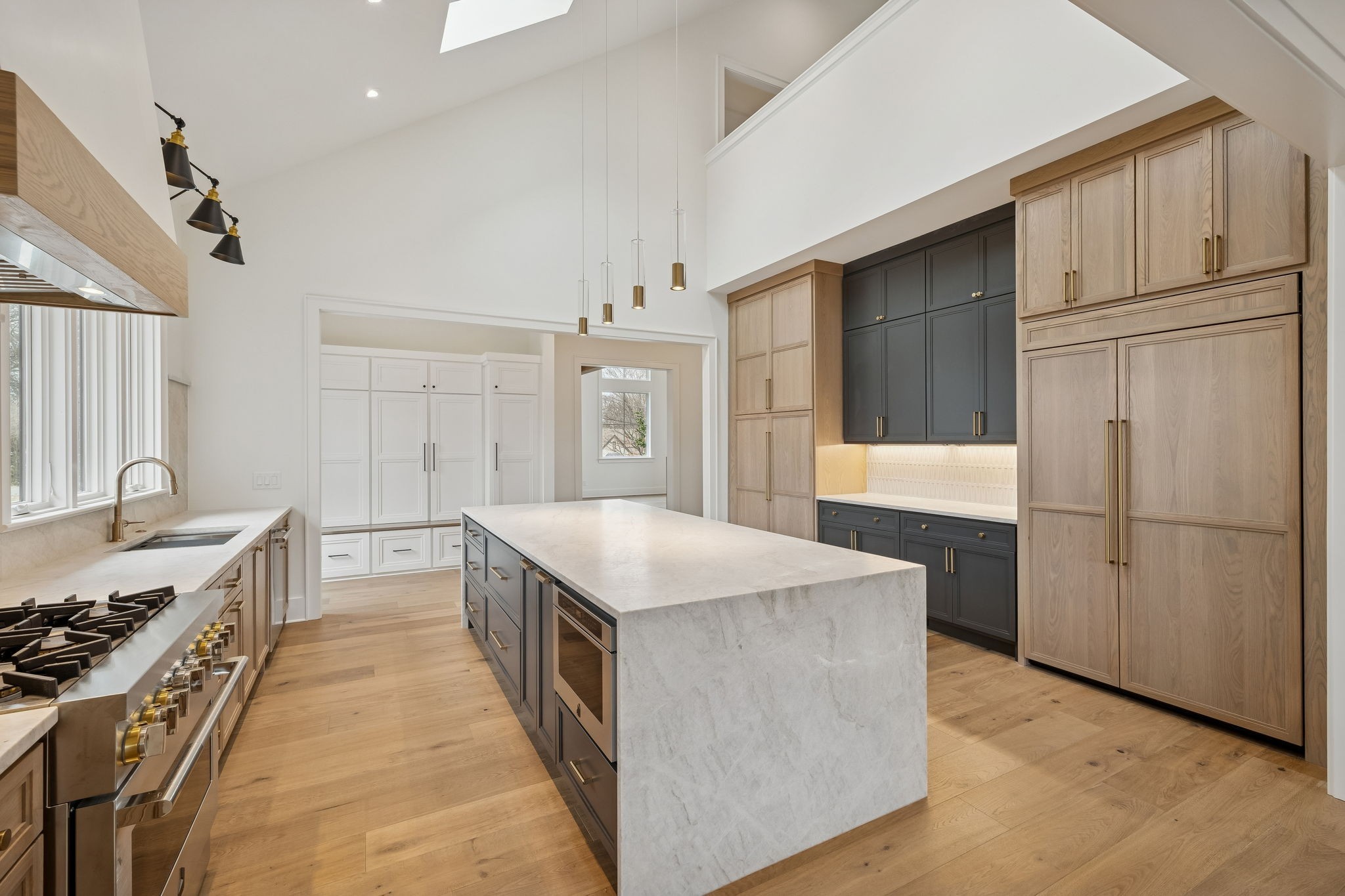 1130 Winding Way Road Nashville, TN 37216 - Photo 28 of 96 a kitchen with stainless steel appliances granite countertop a refrigerator a stove and a sink with wooden floors