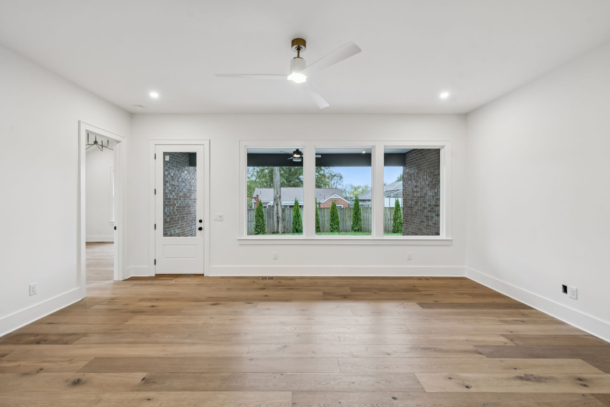 1130 Winding Way Road Nashville, TN 37216 - Photo 43 of 96 a view of an empty room with wooden floor and a window