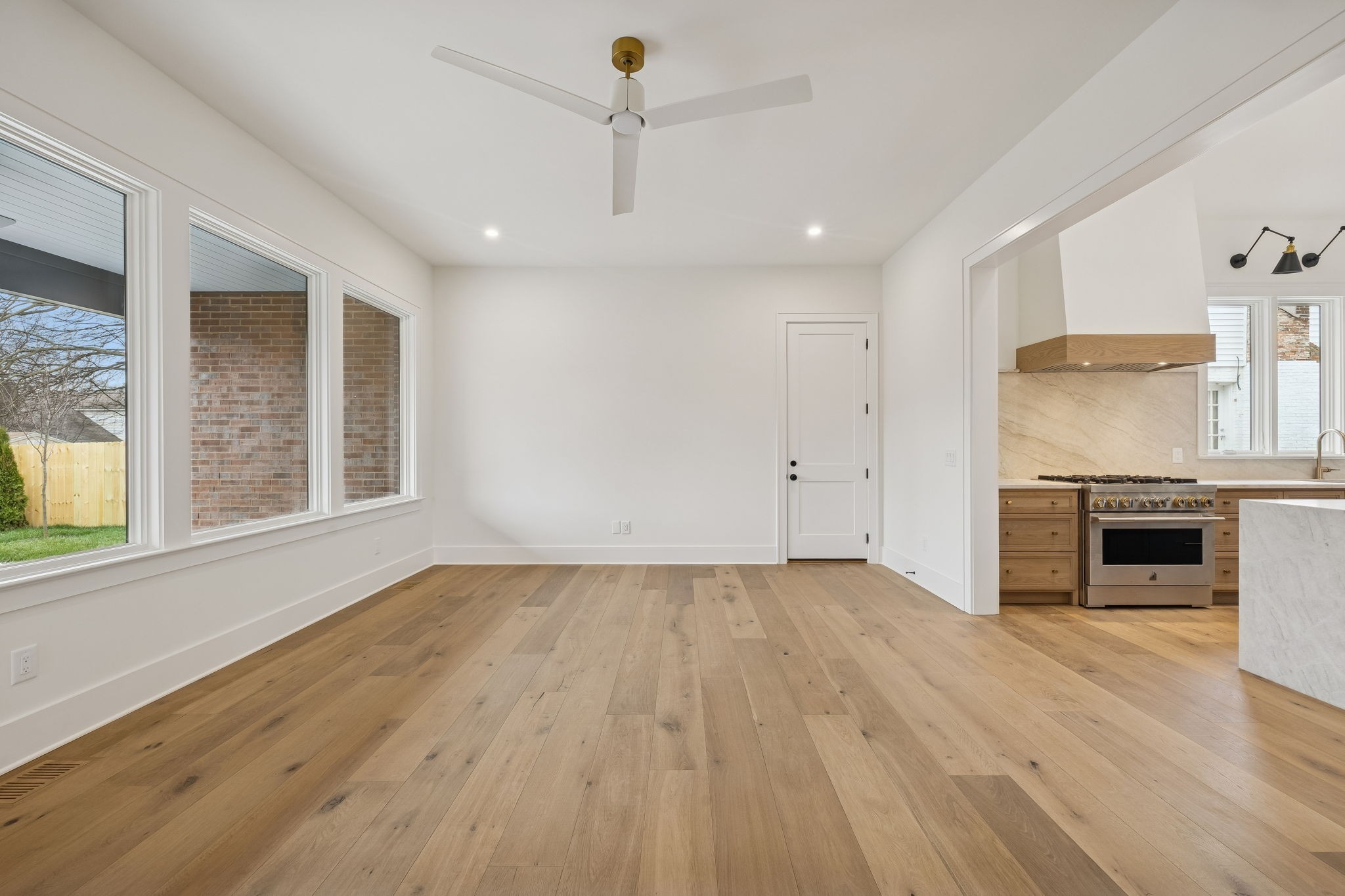 1130 Winding Way Road Nashville, TN 37216 - Photo 45 of 96 an empty room with wooden floor fireplace and windows