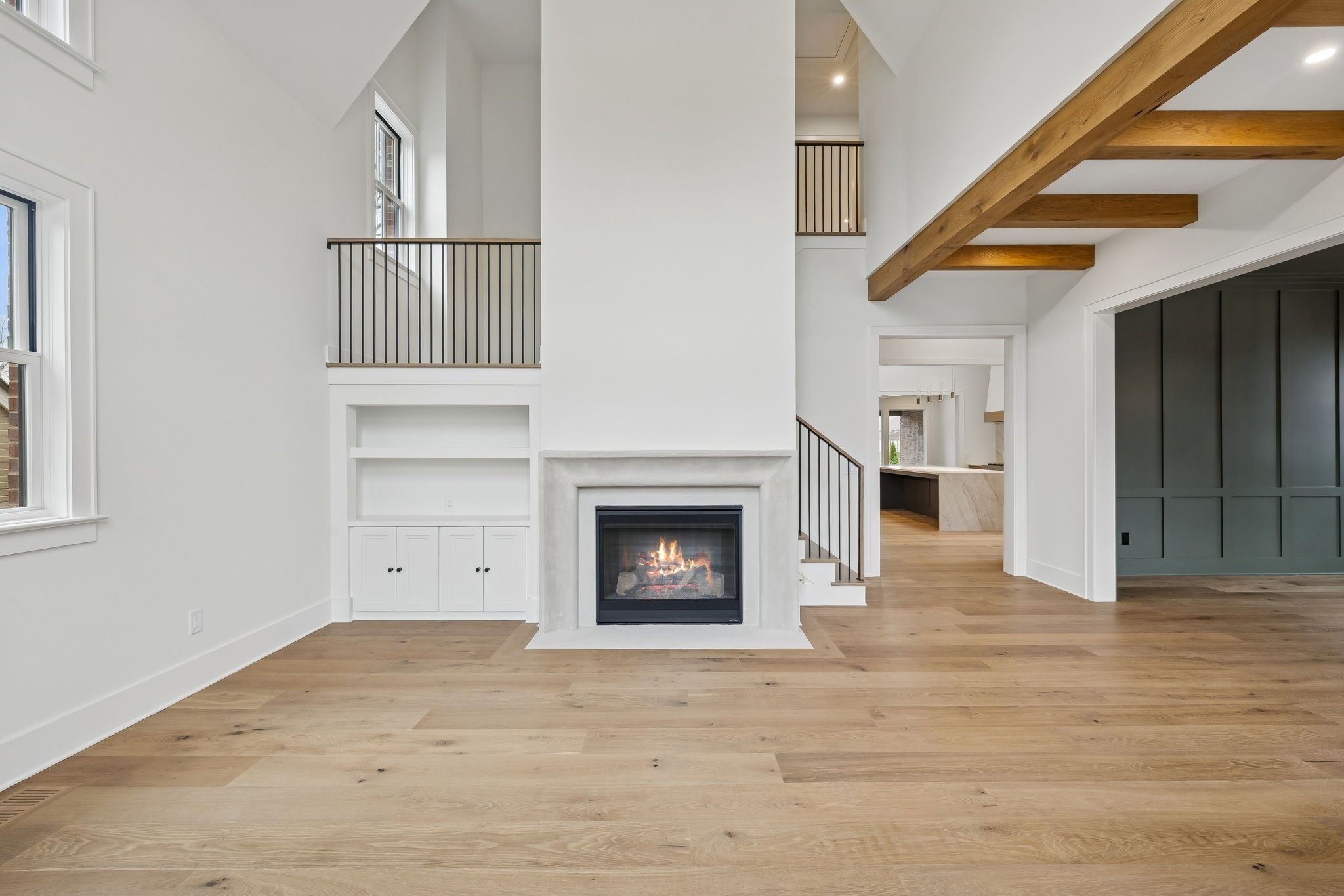 1130 Winding Way Road Nashville, TN 37216 - Photo 6 of 96 a view of an empty room with wooden floor fireplace and a window