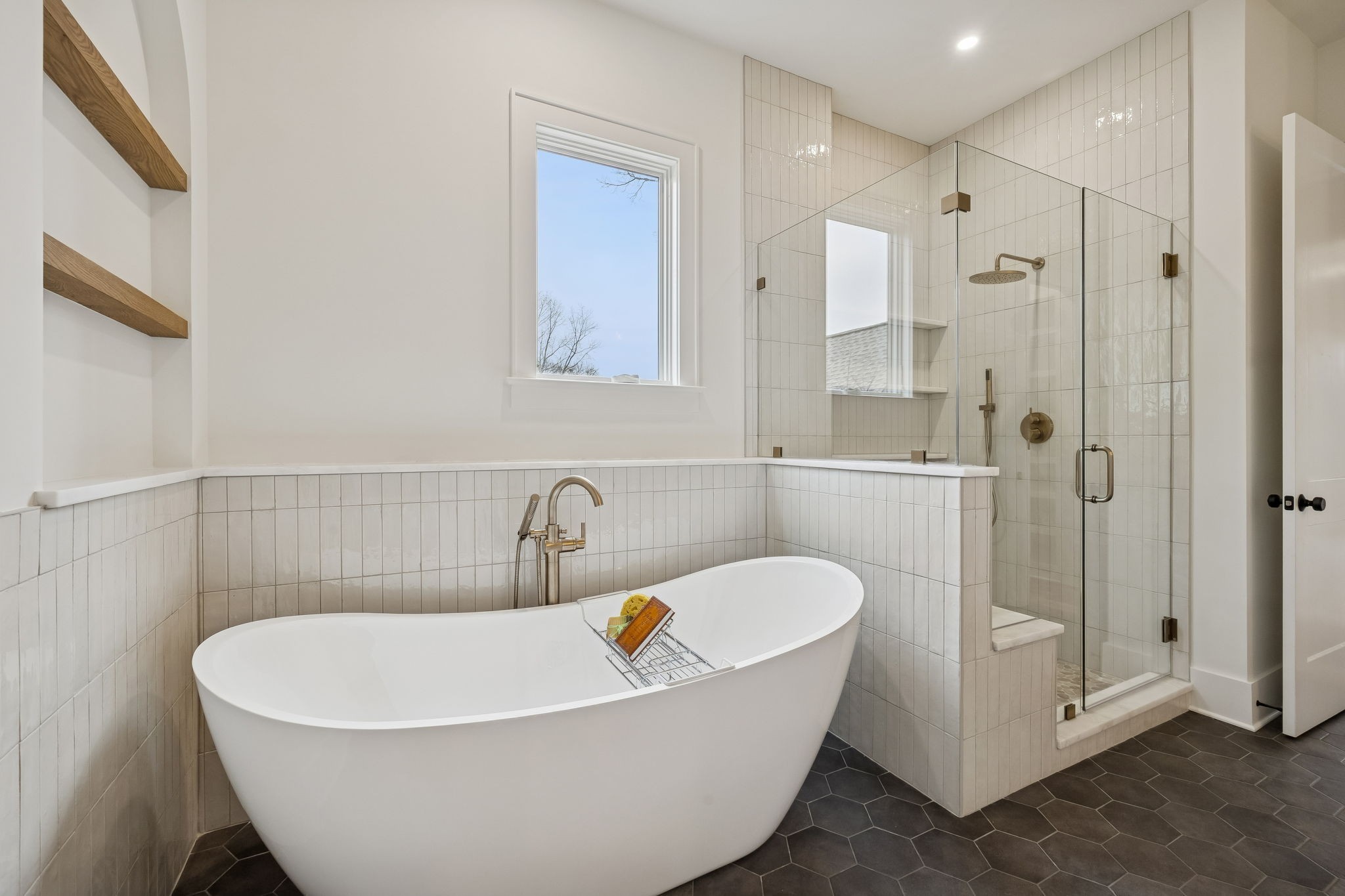 1130 Winding Way Road Nashville, TN 37216 - Photo 65 of 96 a white bath tub sitting next to a bathroom