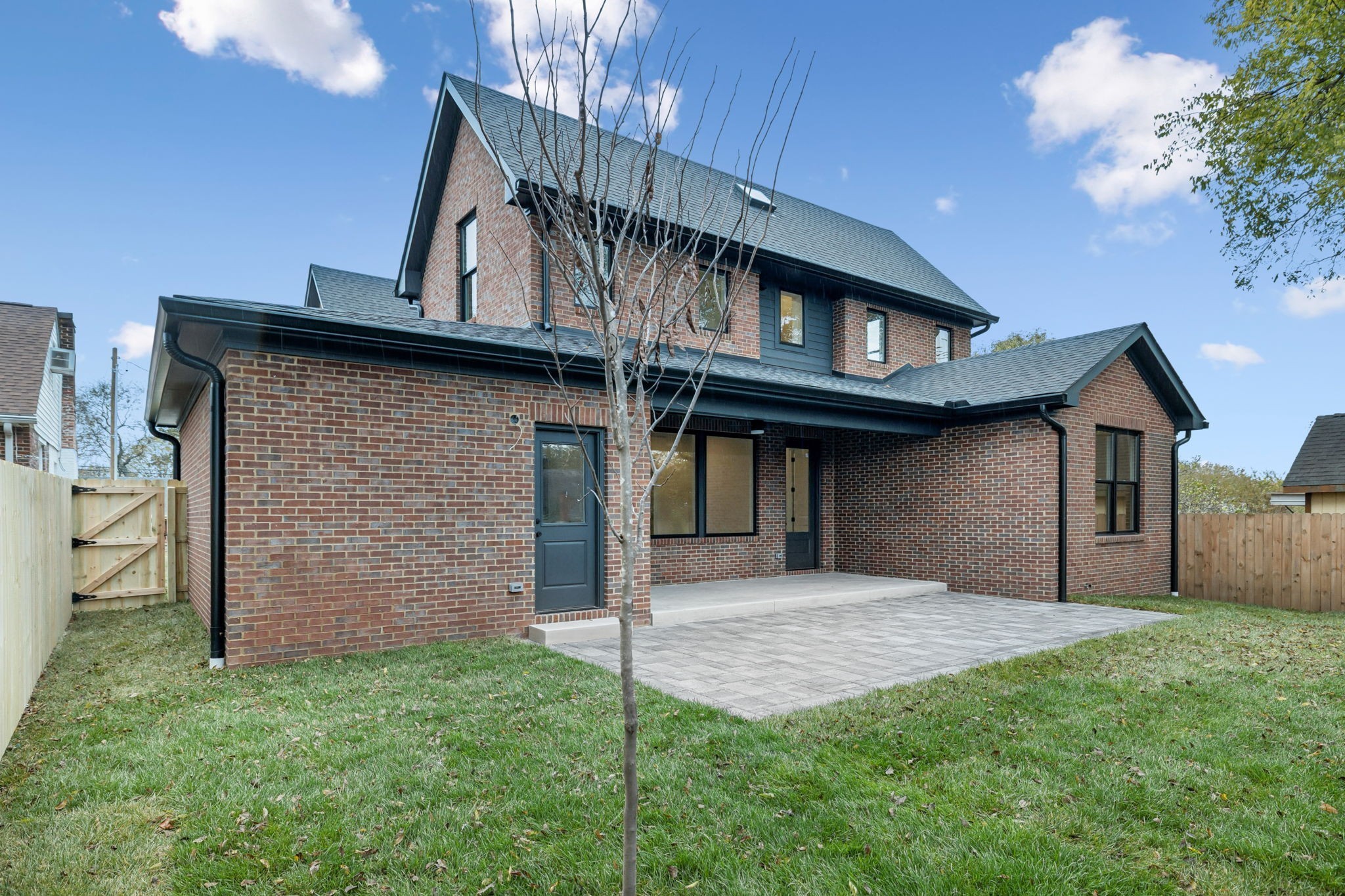 1130 Winding Way Road Nashville, TN 37216 - Photo 91 of 96 a view of a house with brick walls and a yard