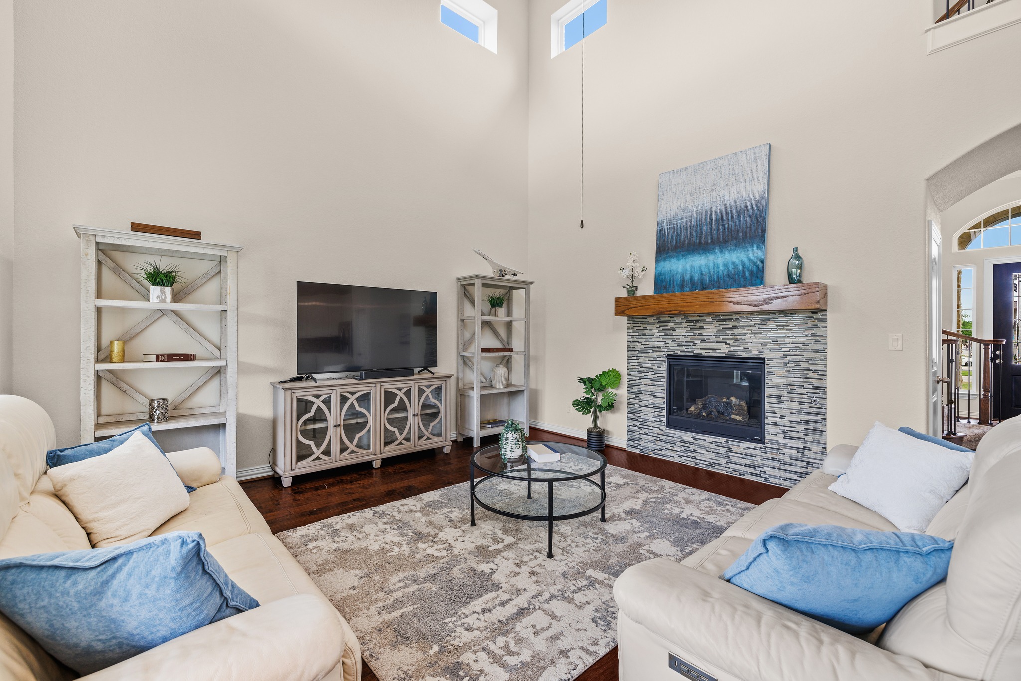 3914 Logan Ridge Drive Cedar Park, TX 78613 - Photo 12 of 40 a living room with furniture a flat screen tv and a fireplace