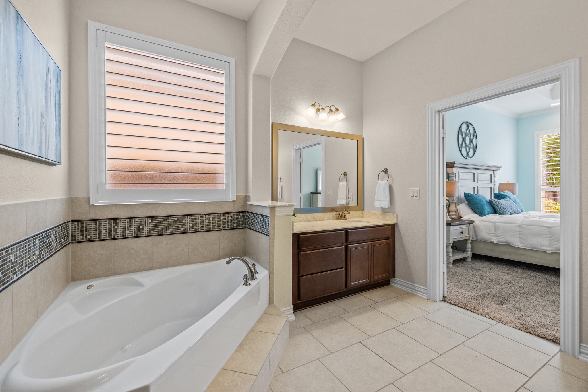 3914 Logan Ridge Drive Cedar Park, TX 78613 - Photo 21 of 40 a spacious bathroom with a tub sink and mirror