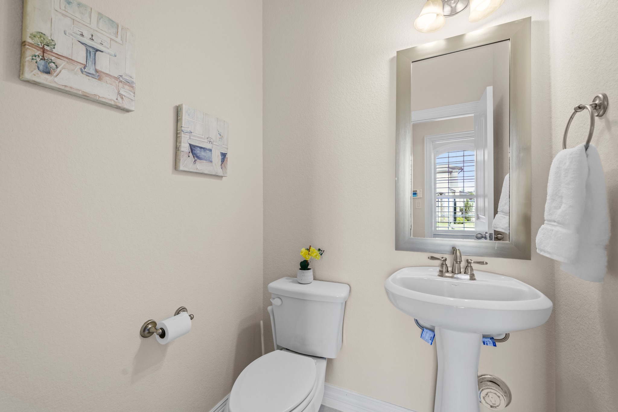 3914 Logan Ridge Drive Cedar Park, TX 78613 - Photo 24 of 40 a bathroom with a sink a mirror and a toilet