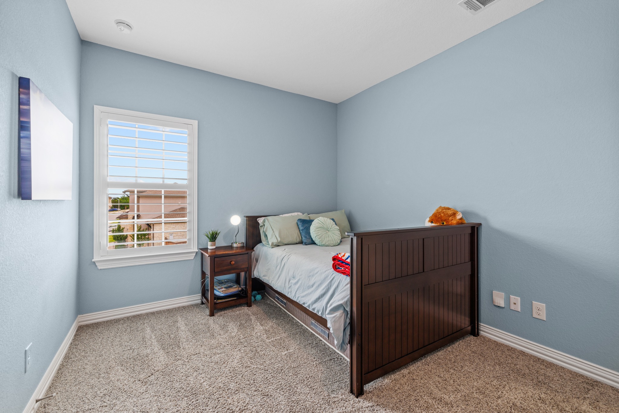 3914 Logan Ridge Drive Cedar Park, TX 78613 - Photo 29 of 40 a bedroom with a bed and a window