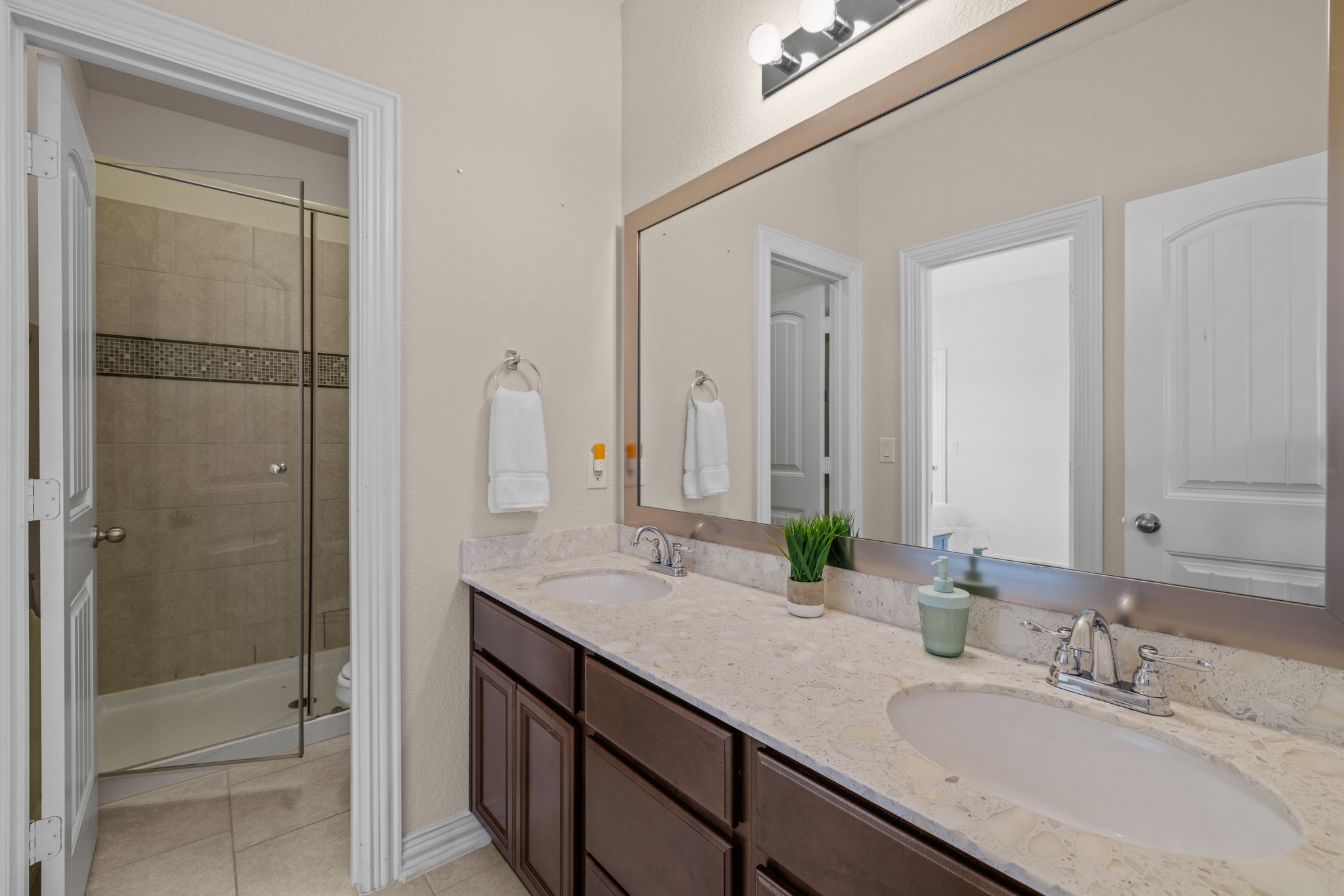 3914 Logan Ridge Drive Cedar Park, TX 78613 - Photo 31 of 40 a bathroom with a granite countertop sink and a mirror