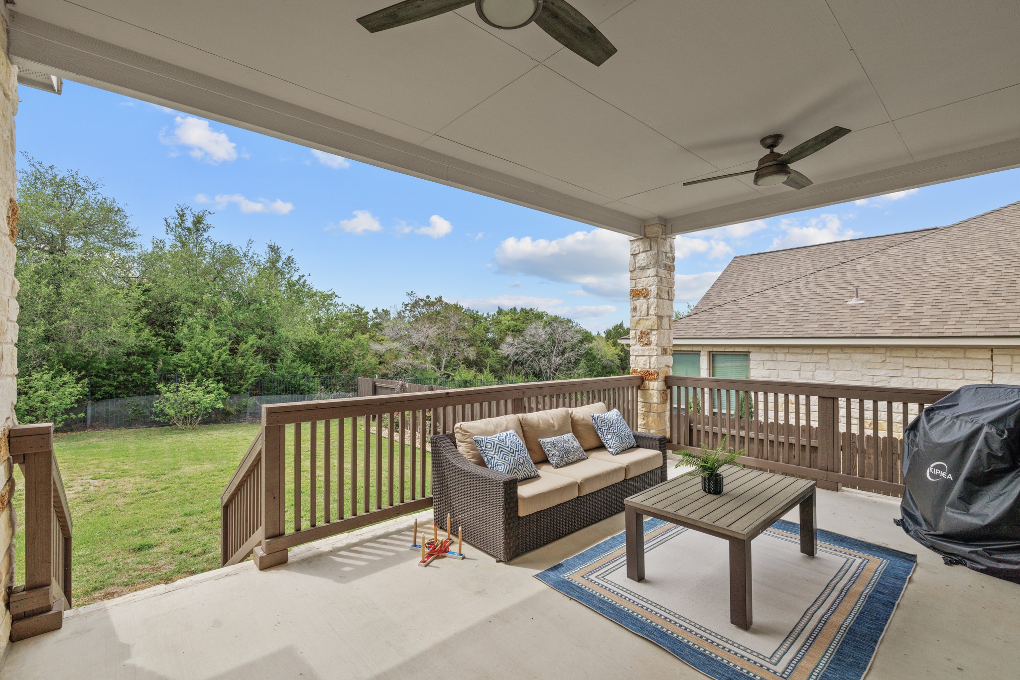3914 Logan Ridge Drive Cedar Park, TX 78613 - Photo 35 of 40 a balcony with wooden floor and outdoor seating