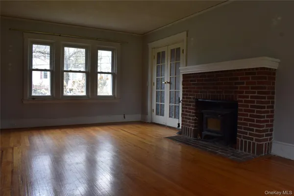 a view of entryway with wooden floor