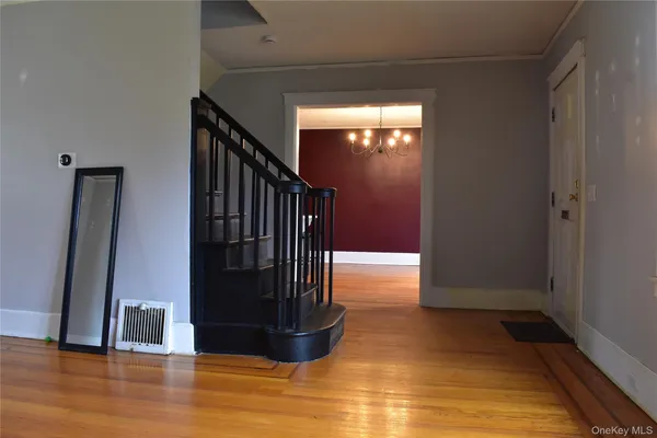 a view of a kitchen from the hallway