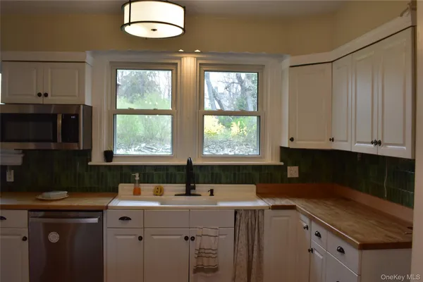 a kitchen with a sink and cabinets