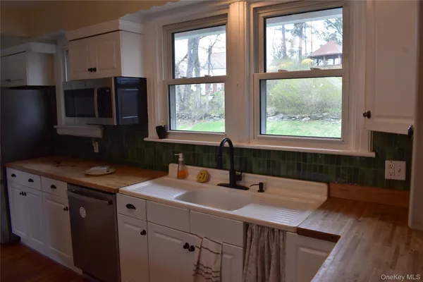 a kitchen with a sink and a refrigerator