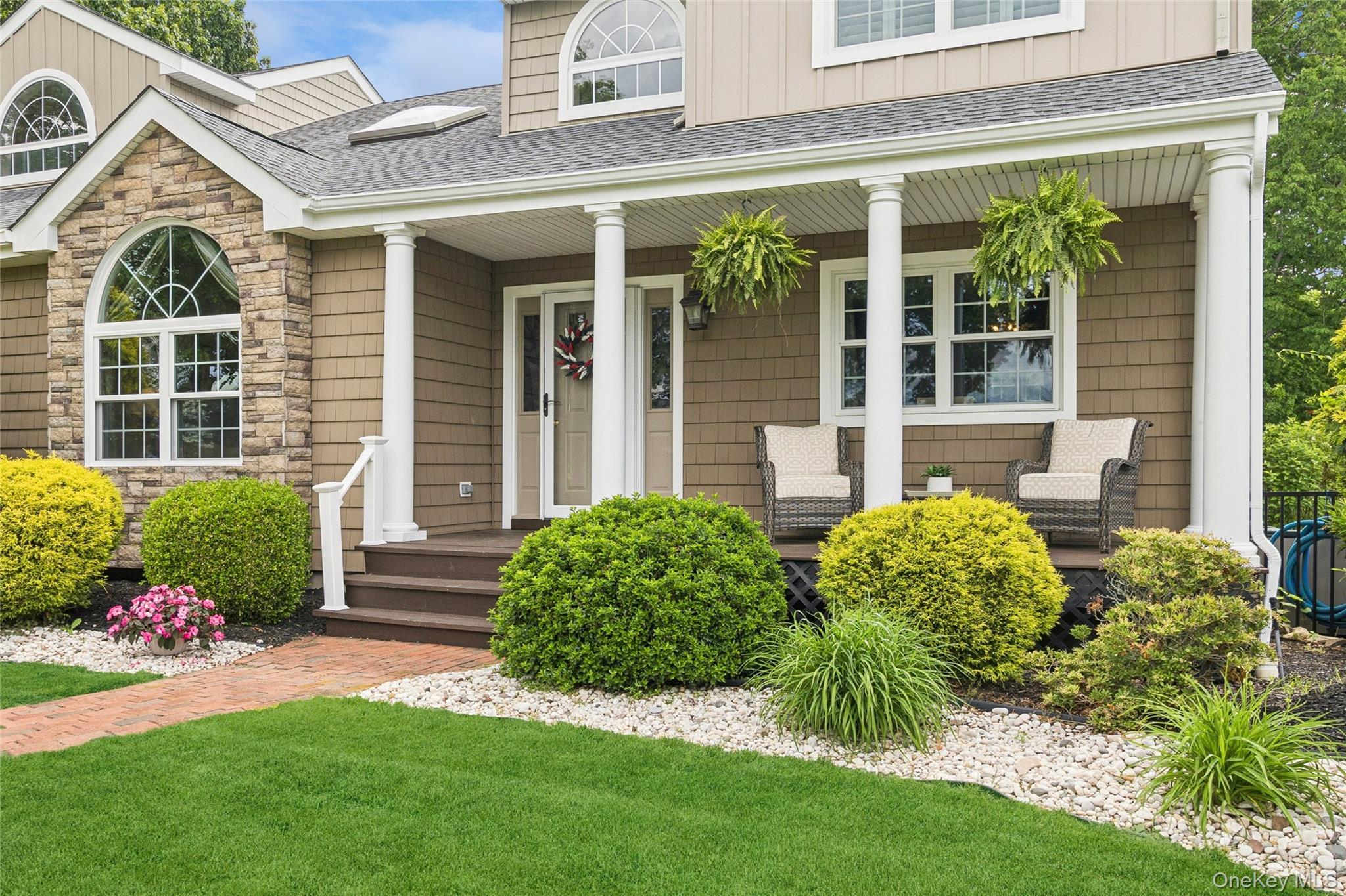 42 Adelia Path Riverhead, NY 11901 - Photo 2 of 30 Front of home featuring a patio seating area