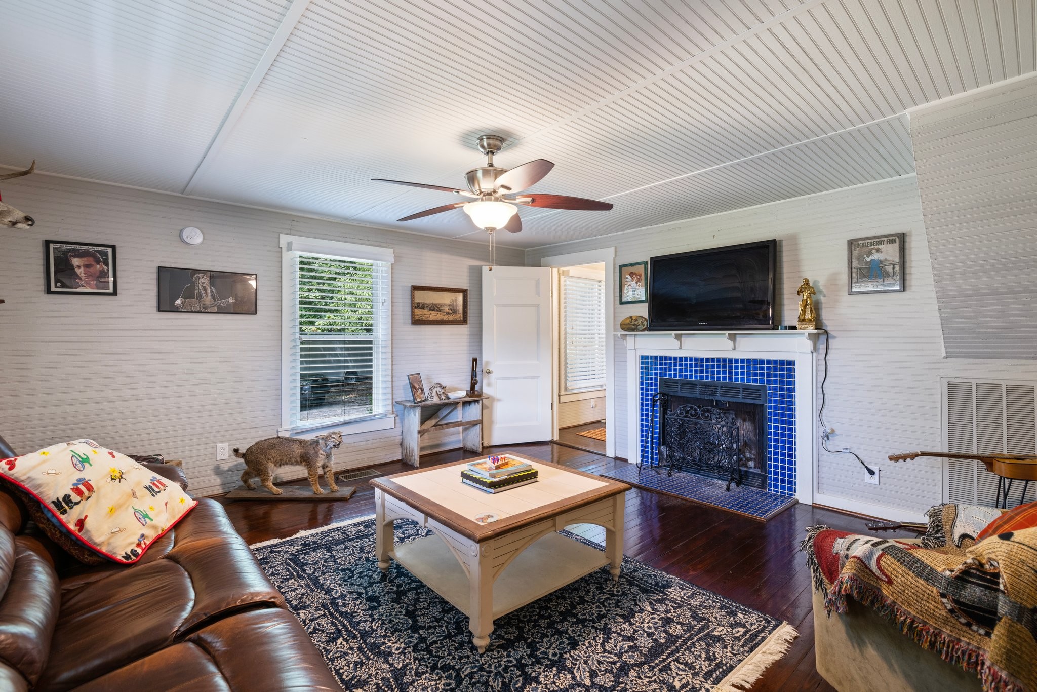 4092 Clovercroft Road Franklin, TN 37067 - Photo 14 of 26 a living room with furniture a flat screen tv and a fireplace