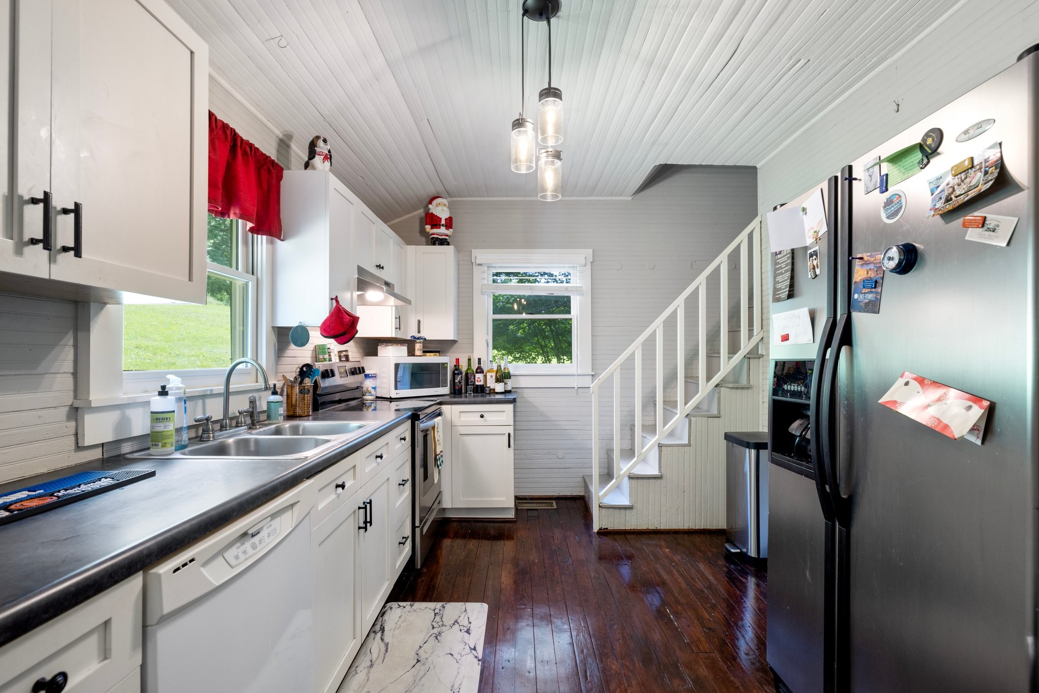4092 Clovercroft Road Franklin, TN 37067 - Photo 18 of 26 a kitchen with granite countertop a refrigerator a sink dishwasher a oven with wooden floor