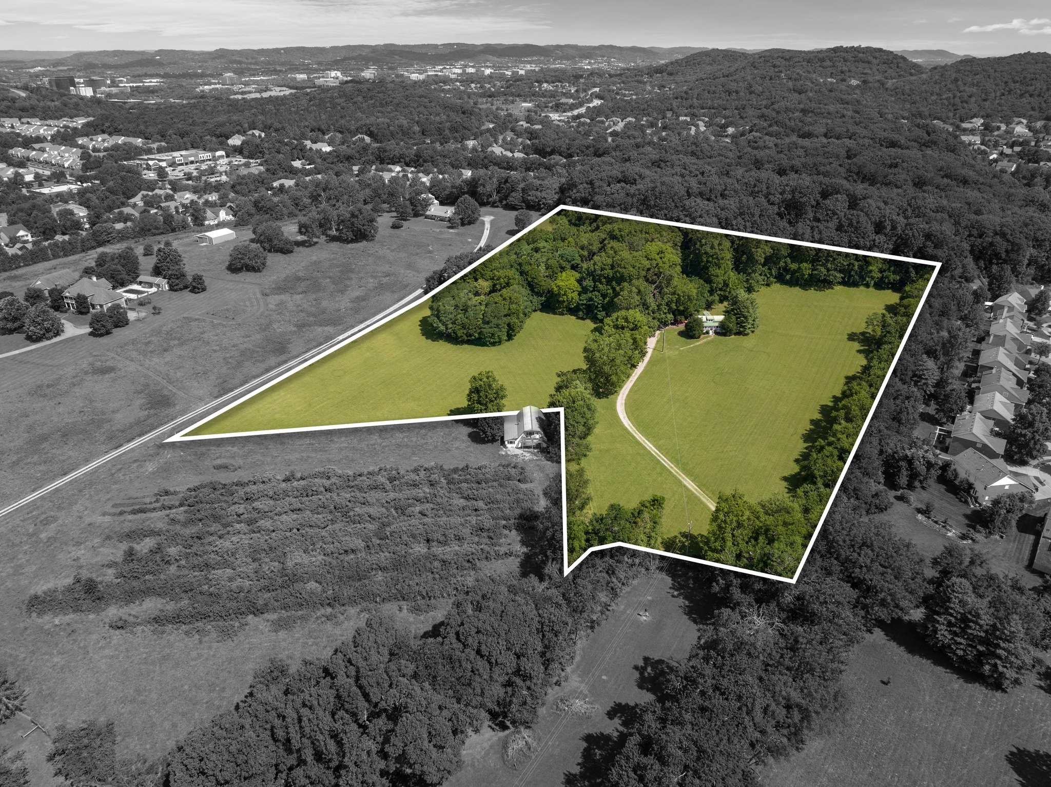 4092 Clovercroft Road Franklin, TN 37067 - Photo 2 of 26 an aerial view of a tennis ground and a mountain view