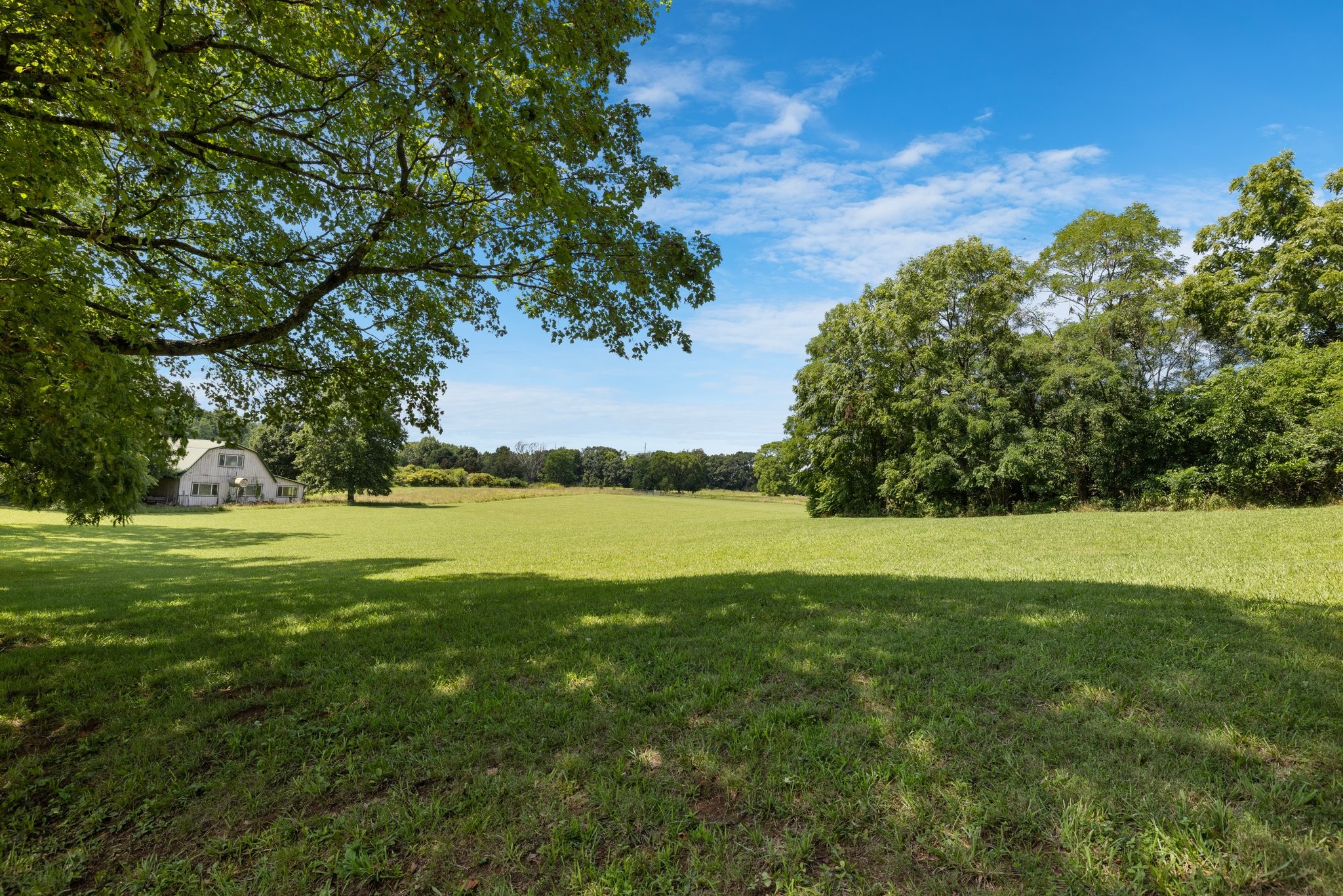 4092 Clovercroft Road Franklin, TN 37067 - Photo 25 of 26 a view of a lake with a yard