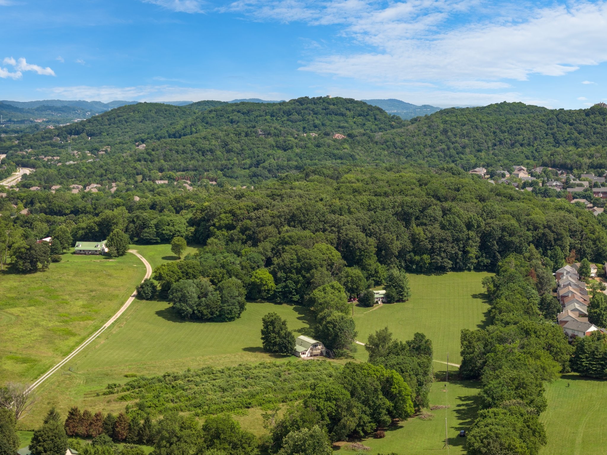 4092 Clovercroft Road Franklin, TN 37067 - Photo 7 of 26 an aerial view of residential houses with outdoor space and trees
