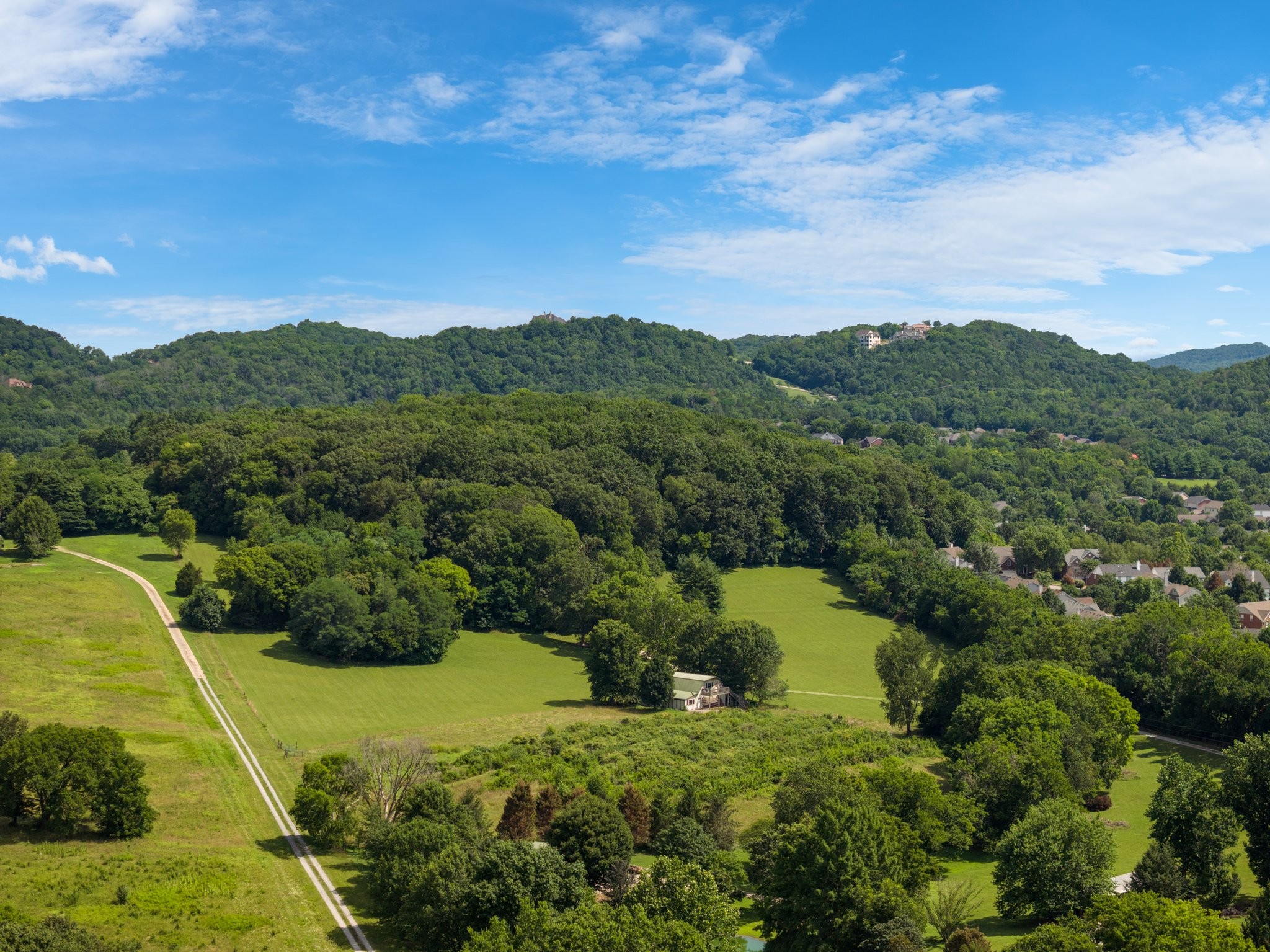4092 Clovercroft Road Franklin, TN 37067 - Photo 8 of 26 a view of a city with lush green forest