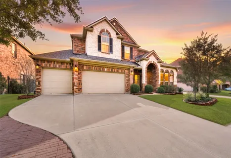a front view of a house with yard