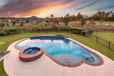 a view of a swimming pool with a lake