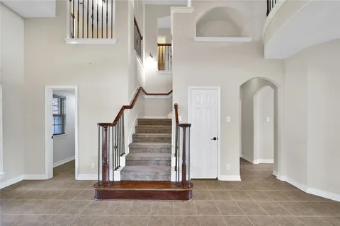 a view of entryway and hall with a front door