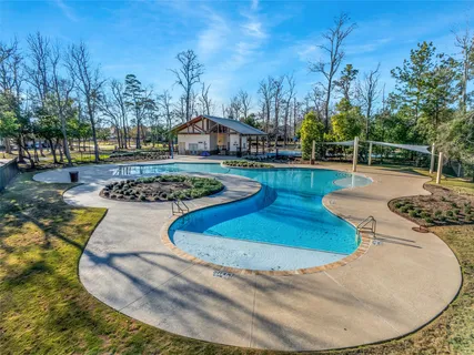 a view of a swimming pool with a patio