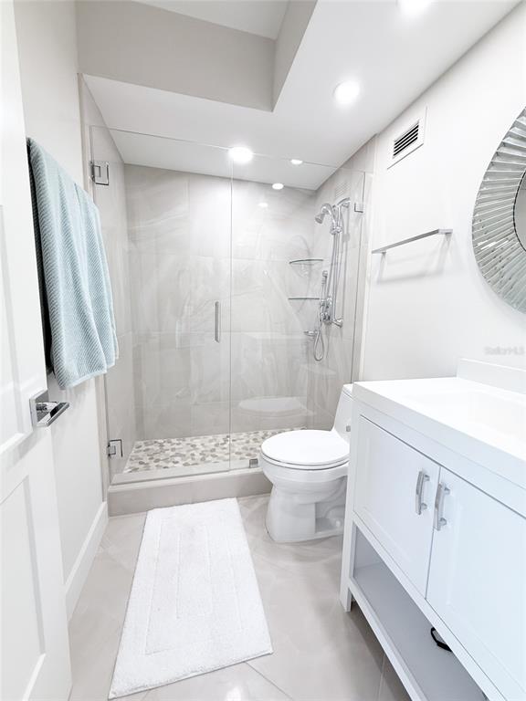 1050 Longboat Club Road, Unit 803 Longboat Key, FL 34228 - Photo 27 of 39 a bathroom with a sink a toilet and shower