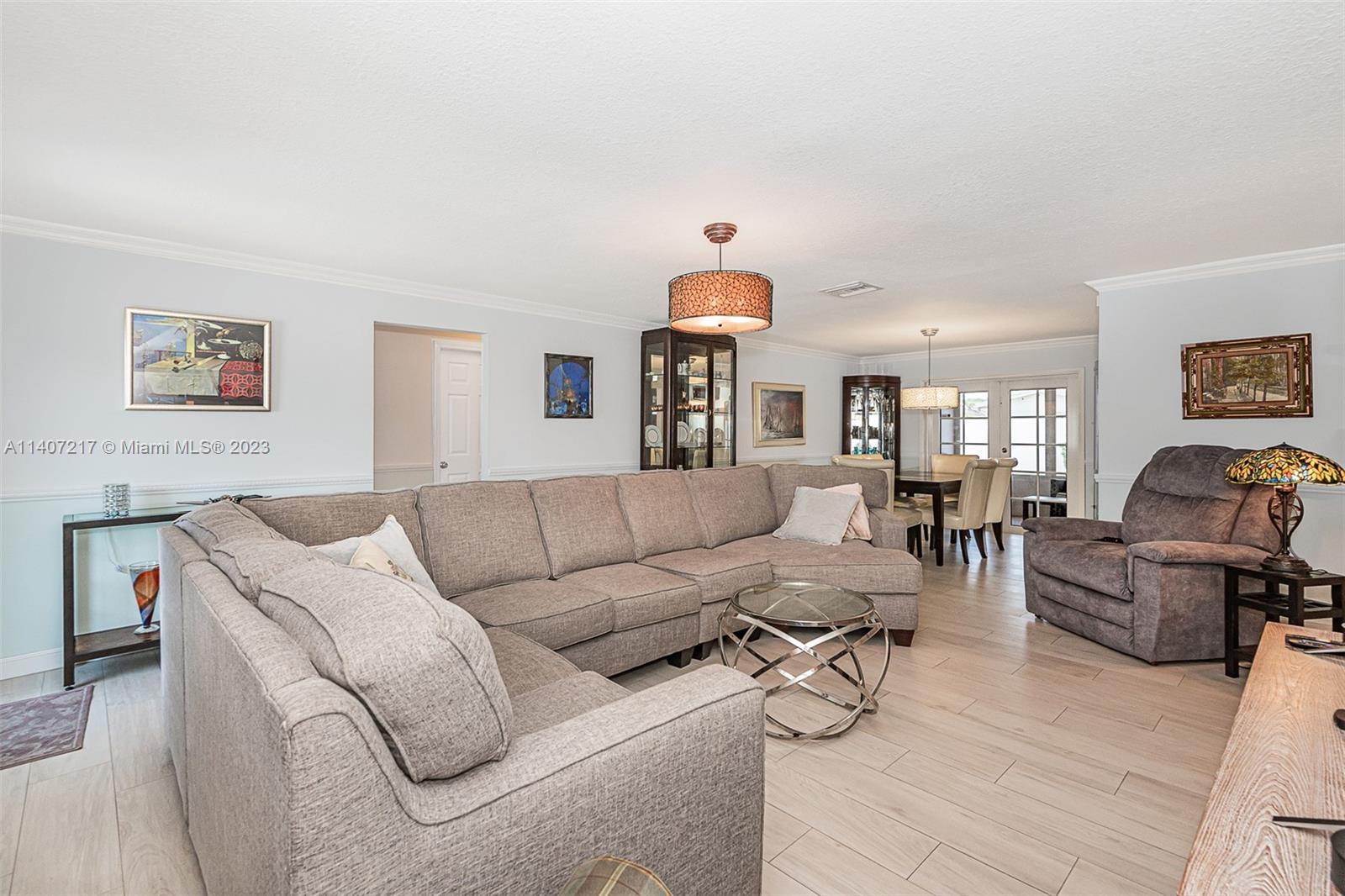 22833 Southwest 65th Way Boca Raton, FL 33428 - Photo 8 of 40 a living room with furniture and a view of kitchen