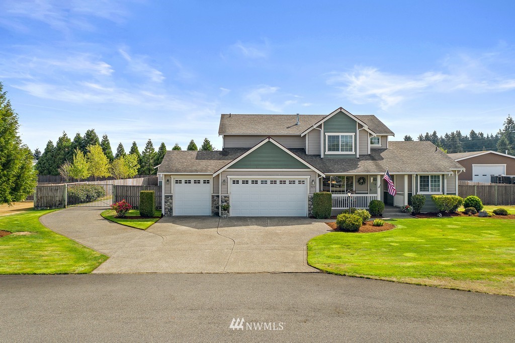 18210 Joseph Drive Southwest Rochester, WA 98579 - Photo 1 of 39 a front view of a house with garden