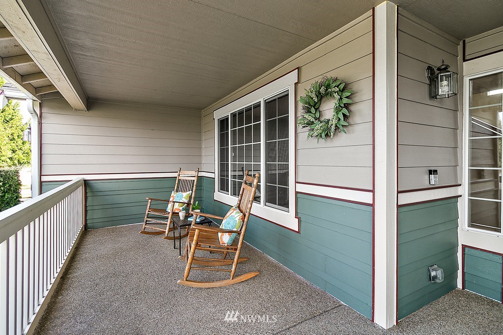 18210 Joseph Drive Southwest Rochester, WA 98579 - Photo 4 of 39 a balcony with table and chairs