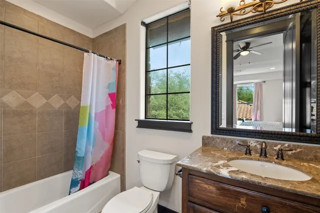 a bedroom with bed and a window