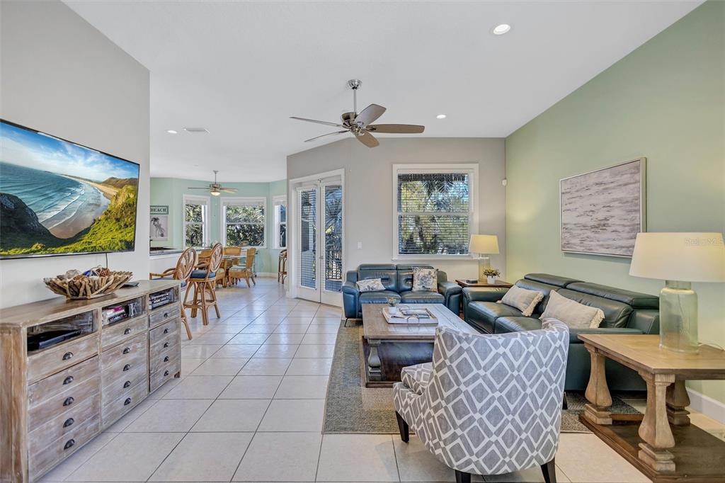 436 Canal Road, Unit A Sarasota, FL 34242 - Photo 24 of 94 a living room with furniture and a flat screen tv