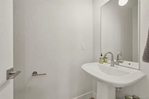 a picture of a bathroom with mirror