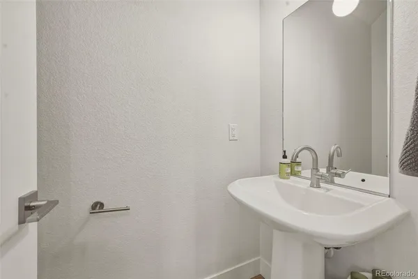 a bathroom with double sink and a mirror