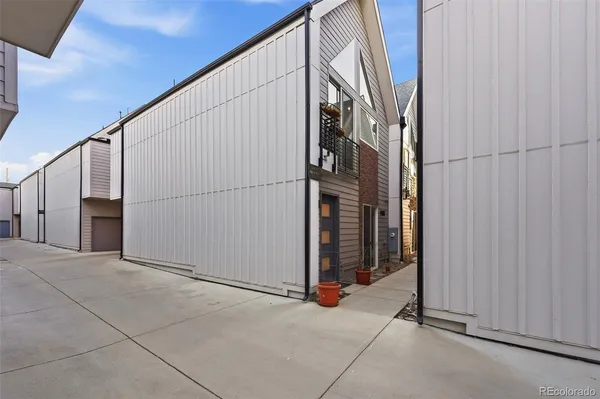a view of a house with a parking space and a garage