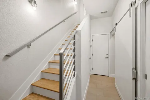 a kitchen with a sink a stove and cabinets