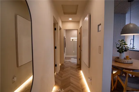 a view of a hallway with furniture and front door