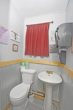 a view of a table and chairs in back yard of the house