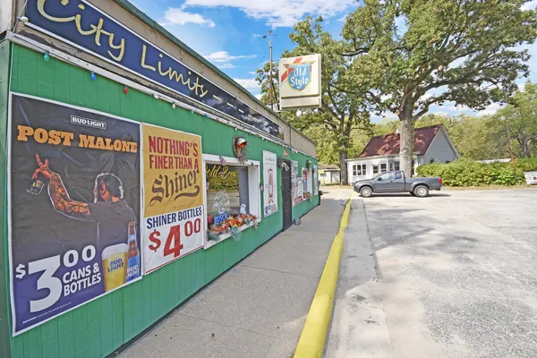 a view of a street with stores