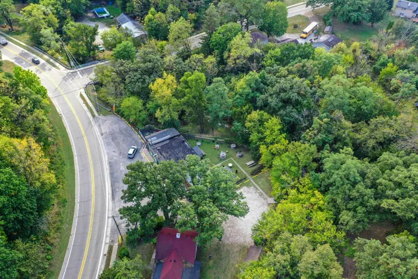 a view of a park with large trees