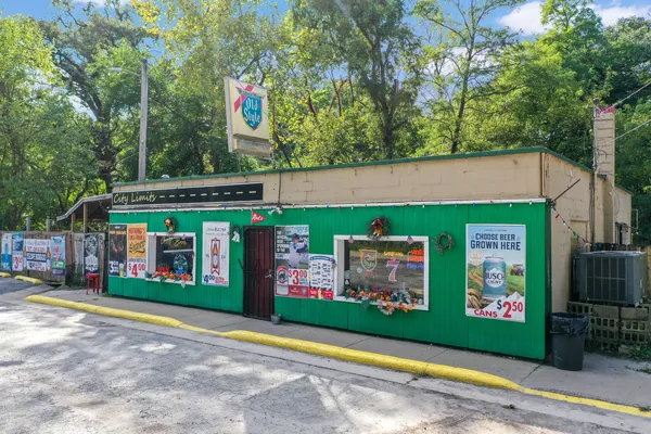 a front view of a house with parking space