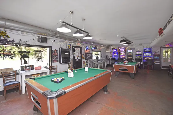 a room with lots of furniture and clutter