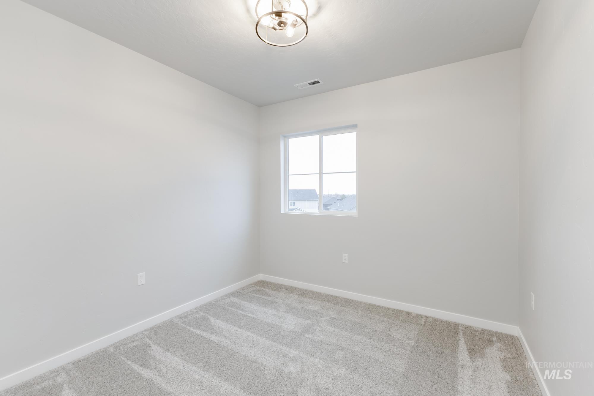 6494 South Sunfish Avenue Boise, ID 83709 - Photo 18 of 32 Carpeted empty room with baseboards